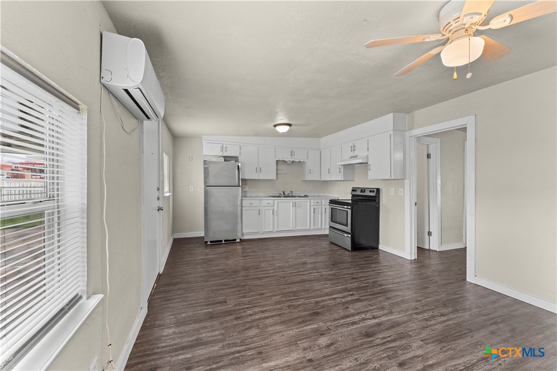 508 Rhode Island Street Killeen, TX 76541 - Photo 5 of 8 a view of a kitchen with wooden floor and electronic appliances