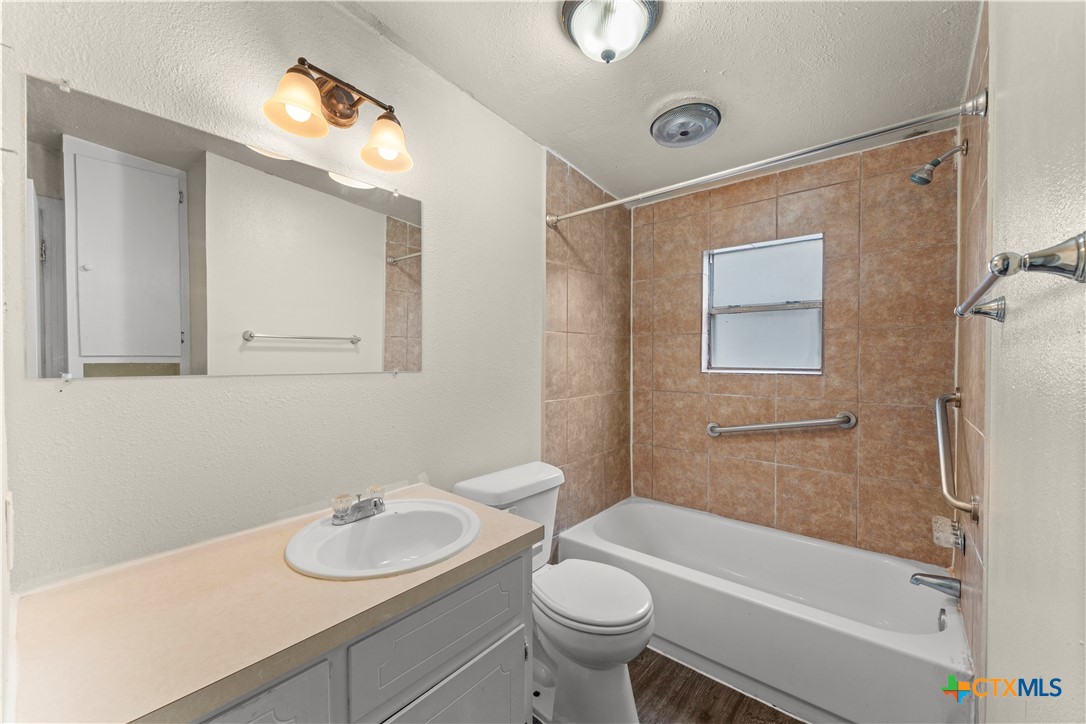 508 Rhode Island Street Killeen, TX 76541 - Photo 8 of 8 a bathroom with a sink a toilet and shower