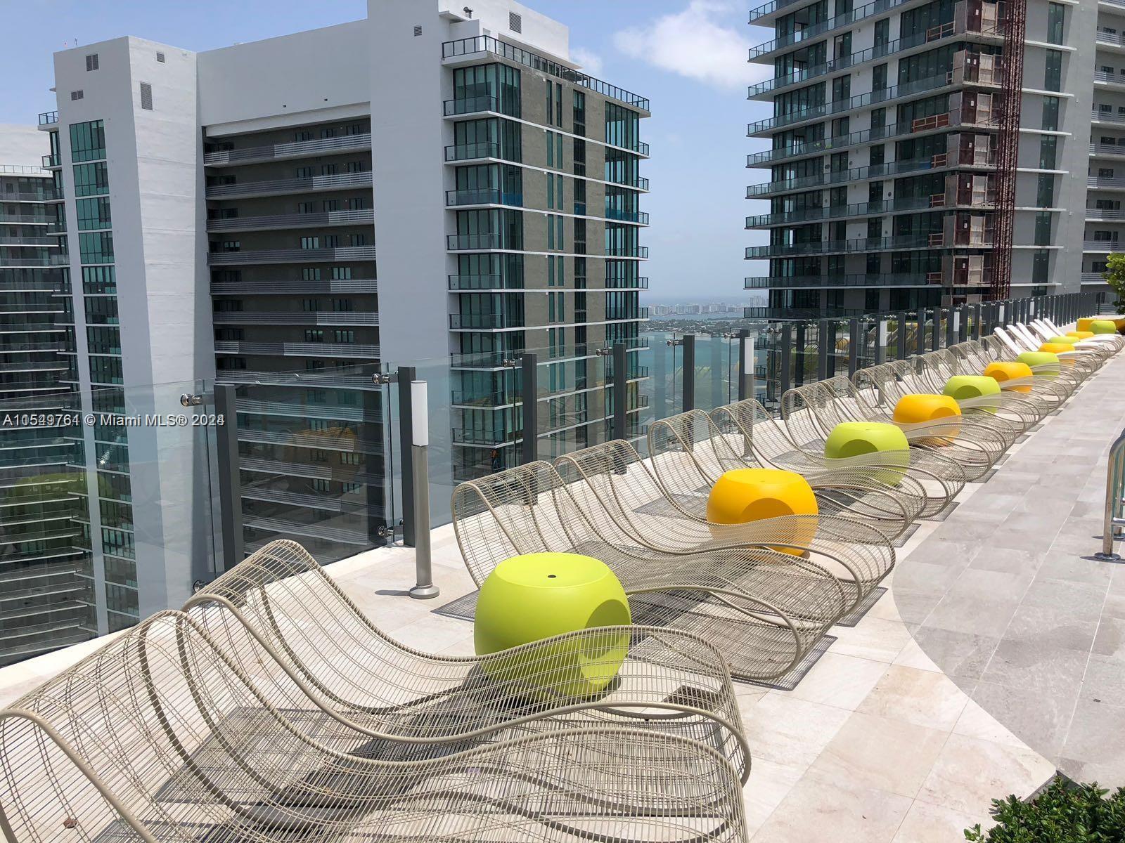 501 Northeast 31st Street, Unit 3003 Miami, FL 33137 - Photo 23 of 28 a view of a swimming pool with a patio