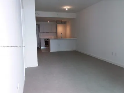 a kitchen with a sink and a stove top oven