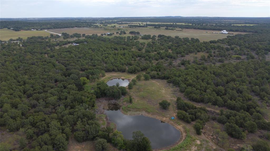 1685 Rocky Mound Road Graham, TX 76450 - Photo 13 of 39 an aerial view of a houses with outdoor space and trees