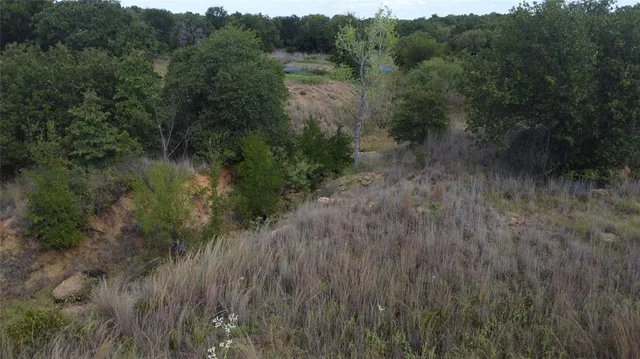 a view of a backyard with sitting area