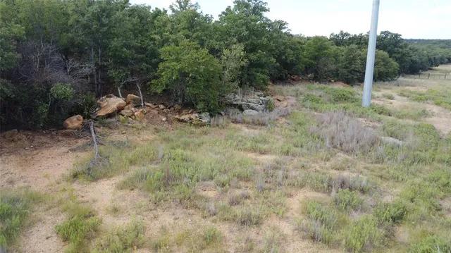 a living room with furniture a flat screen tv and a table