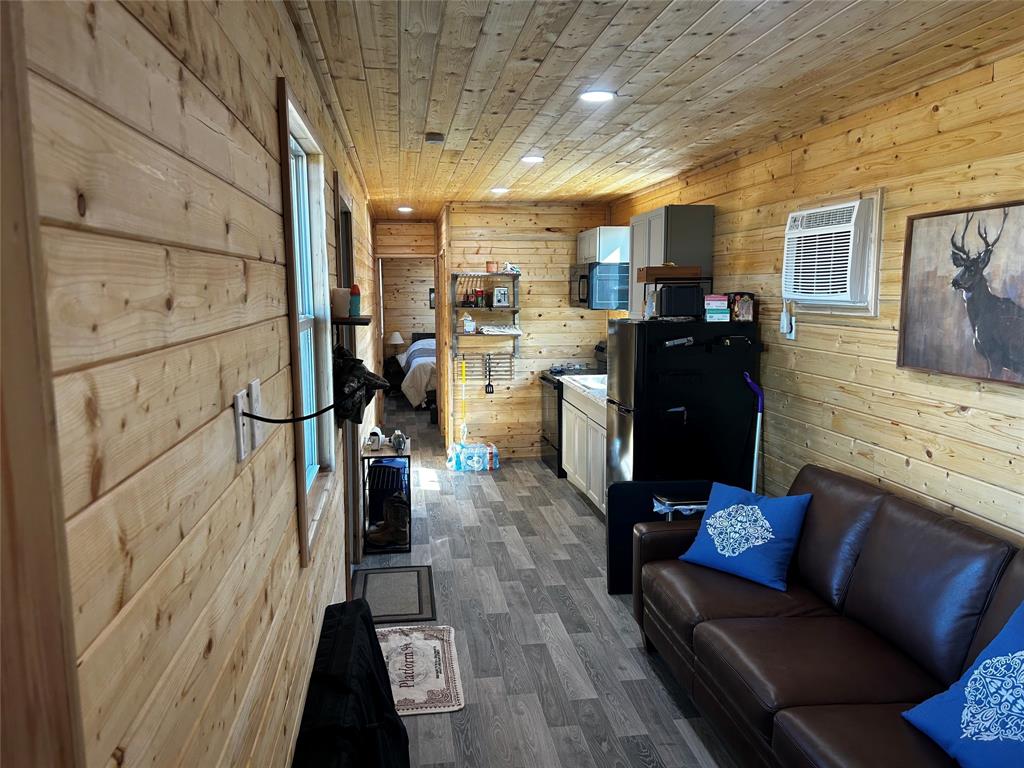 1685 Rocky Mound Road Graham, TX 76450 - Photo 34 of 39 a living room with furniture a flat screen tv and a table