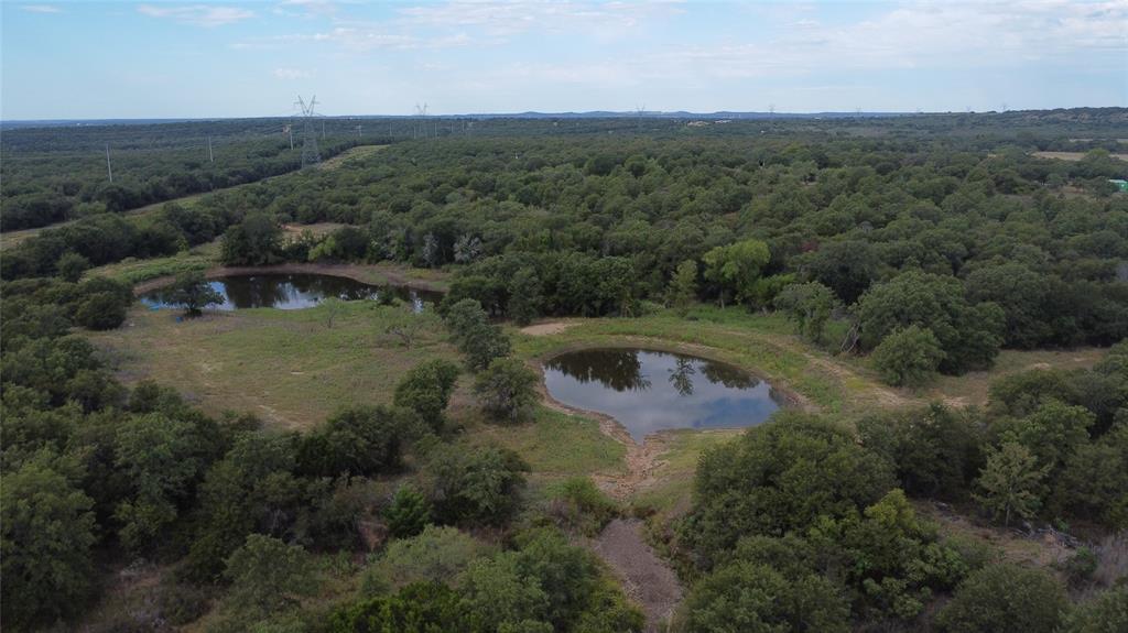1685 Rocky Mound Road Graham, TX 76450 - Photo 10 of 39 an aerial view of residential house with outdoor space and trees all around