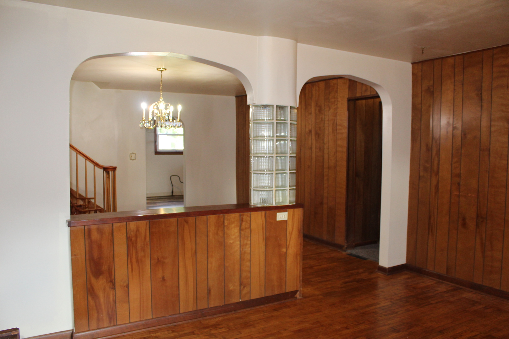 213 North Peoria Street Gilman, IL 60938 - Photo 12 of 44 wooden floor in a hall with a mirror