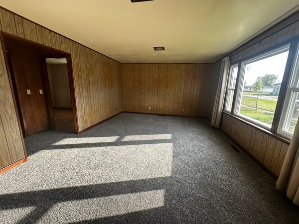 a view of an empty room with a window
