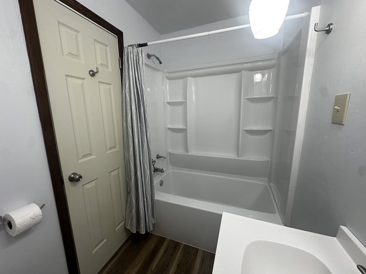 213 North Peoria Street Gilman, IL 60938 - Photo 21 of 44 a bathroom with a bathtub and a shower