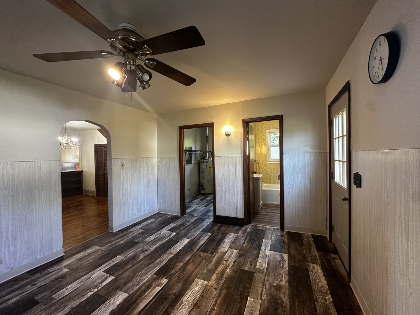 213 North Peoria Street Gilman, IL 60938 - Photo 25 of 44 a view of a hallway with wooden floor and staircase