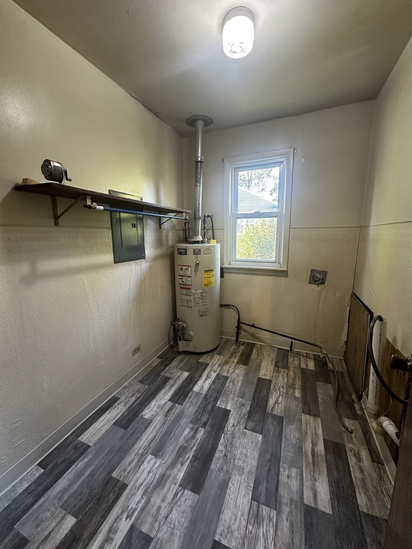 213 North Peoria Street Gilman, IL 60938 - Photo 28 of 44 a view of a room with wooden floor and chair