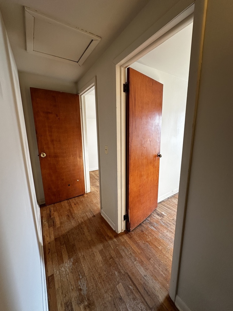 213 North Peoria Street Gilman, IL 60938 - Photo 33 of 44 a view of a hallway with wooden floor and closet