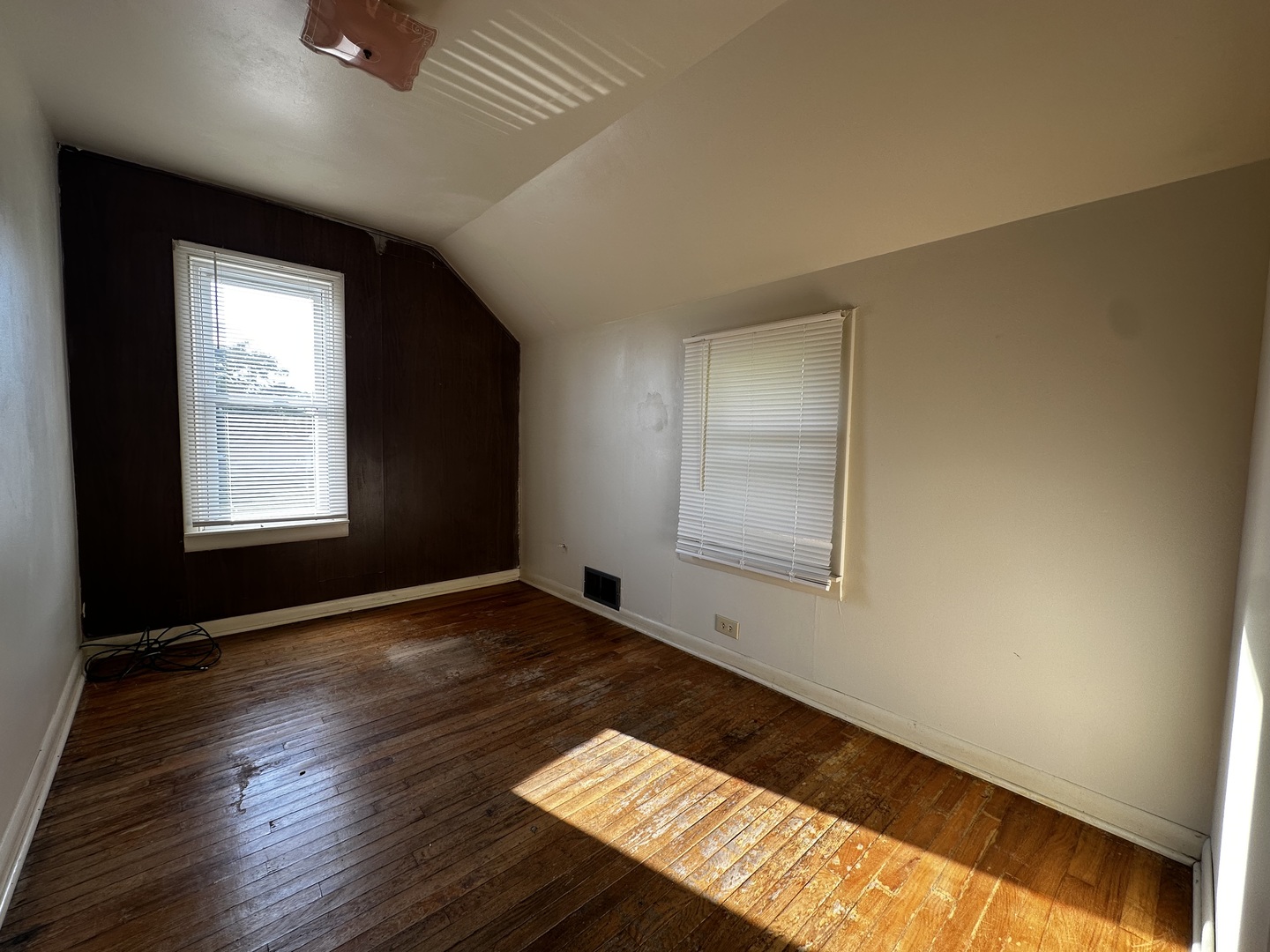 213 North Peoria Street Gilman, IL 60938 - Photo 34 of 44 an empty room with wooden floor and windows
