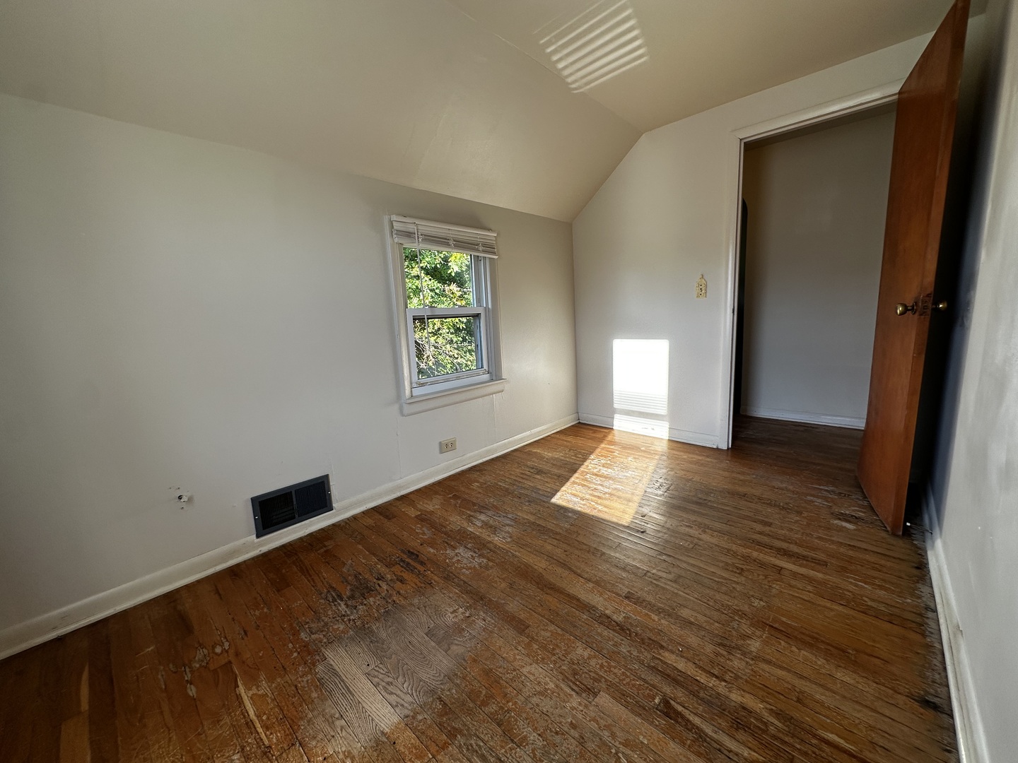 213 North Peoria Street Gilman, IL 60938 - Photo 35 of 44 a view of empty room with window and wooden floor