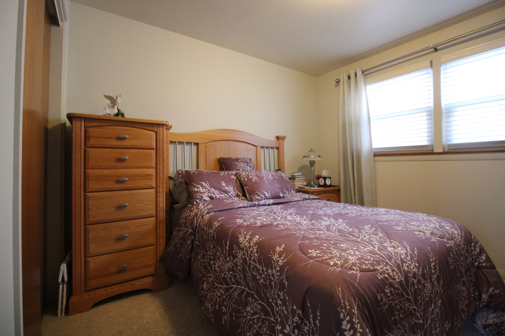 Undisclosed Address Chicago, IL 60638 - Photo 13 of 20 a bedroom with a bed and a window