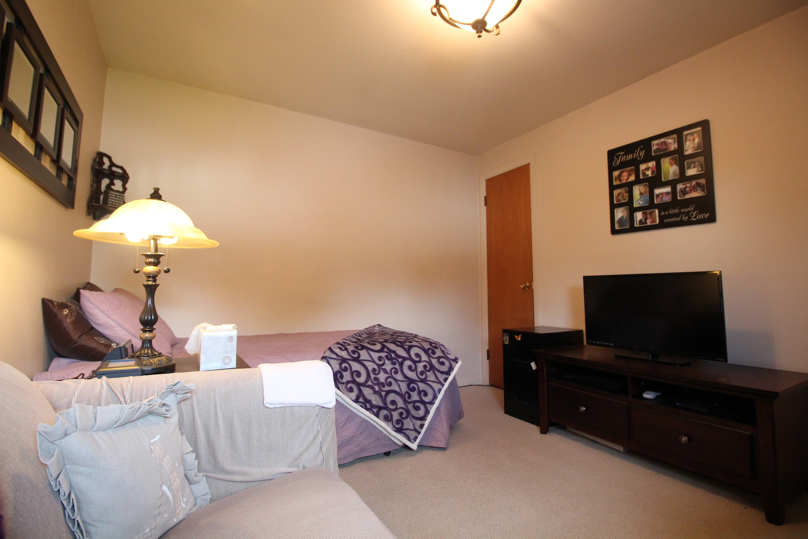 Undisclosed Address Chicago, IL 60638 - Photo 17 of 20 a living room with furniture and a flat screen tv