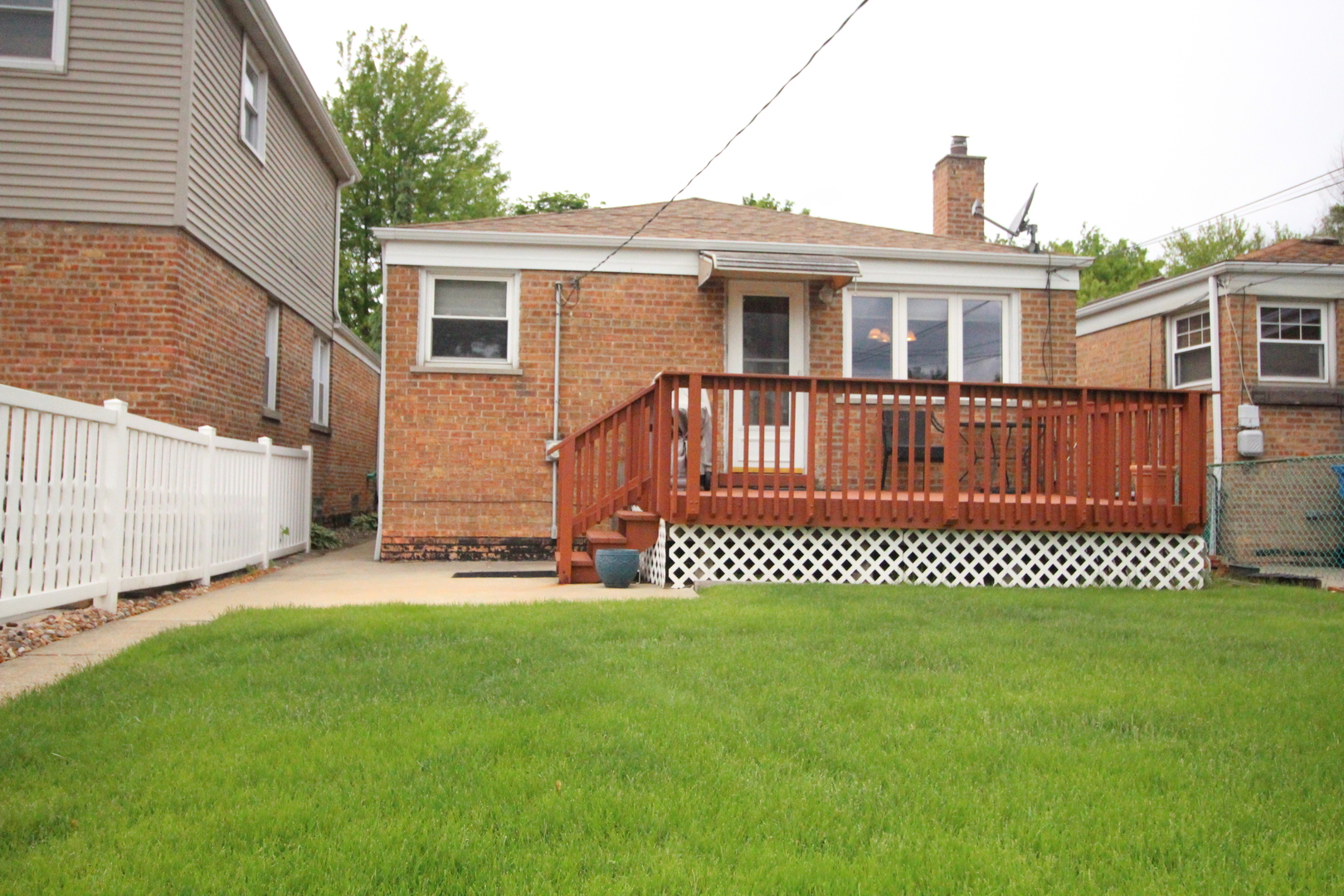 Undisclosed Address Chicago, IL 60638 - Photo 4 of 20 a front view of a house with a garden