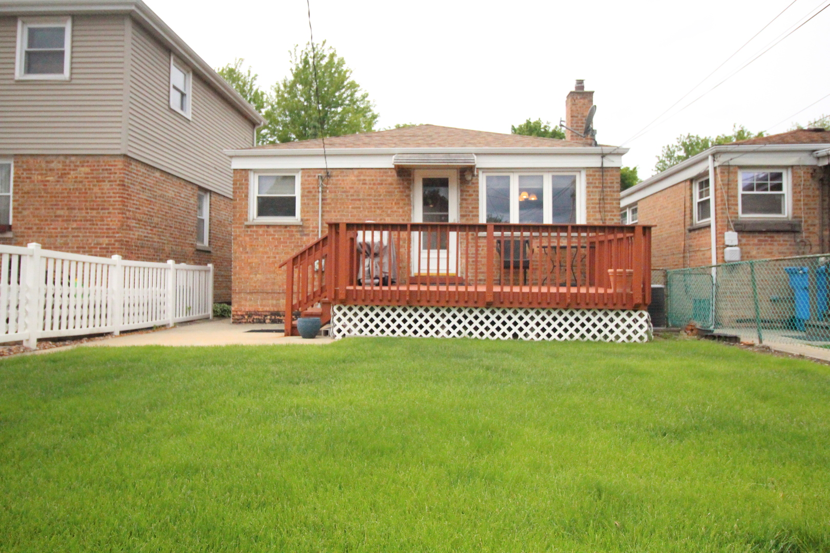 Undisclosed Address Chicago, IL 60638 - Photo 5 of 20 a front view of a house with a garden