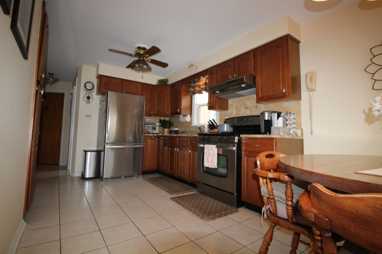 Undisclosed Address Chicago, IL 60638 - Photo 8 of 20 a kitchen with stainless steel appliances a stove a refrigerator and a sink
