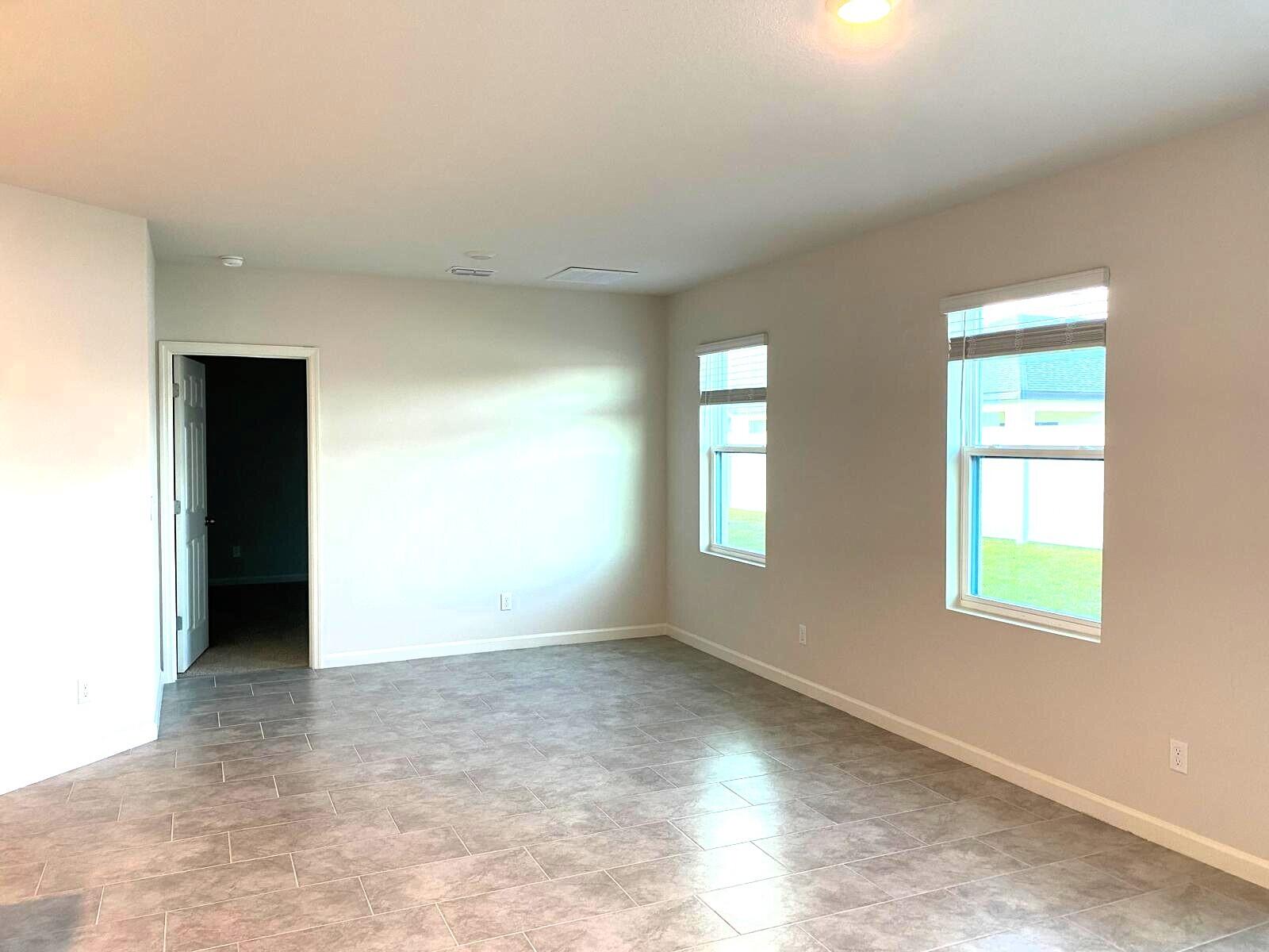9622 Seaspray Drive Fort Pierce, FL 34945 - Photo 11 of 32 an empty room with windows