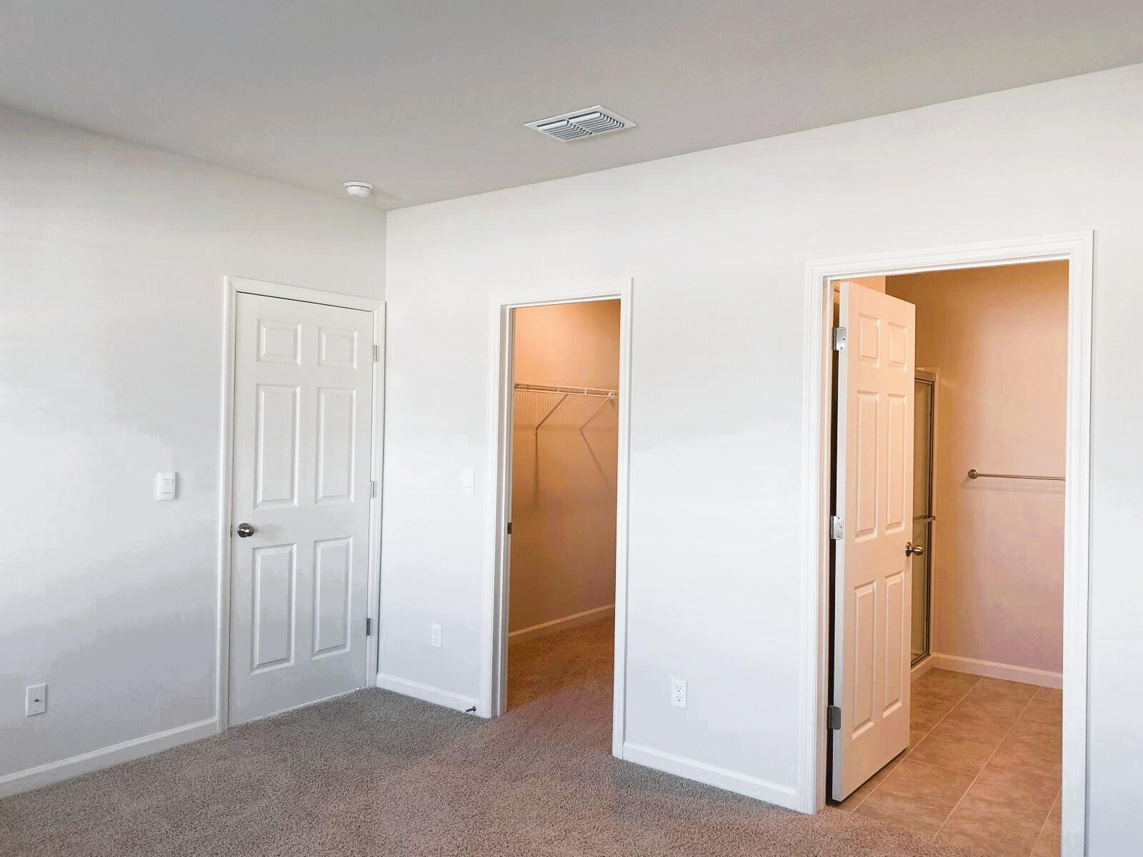 9622 Seaspray Drive Fort Pierce, FL 34945 - Photo 15 of 32 an empty room with windows and closet