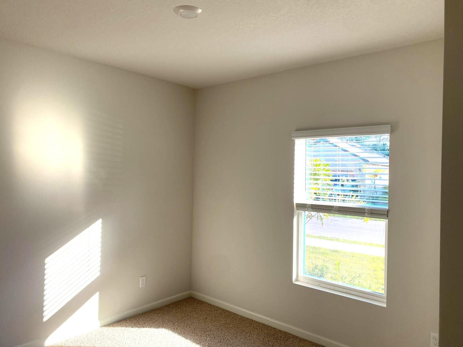 9622 Seaspray Drive Fort Pierce, FL 34945 - Photo 19 of 32 a view of an empty room and a window