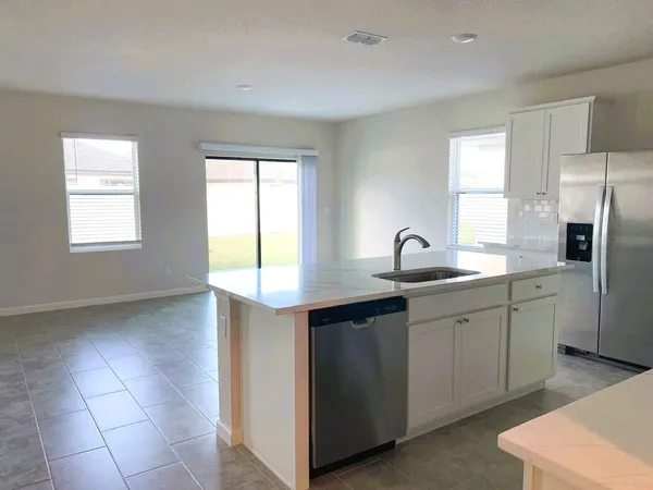 a kitchen with sink and window