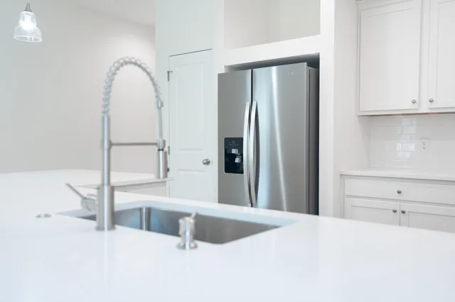 a view of cabinets and wooden floor
