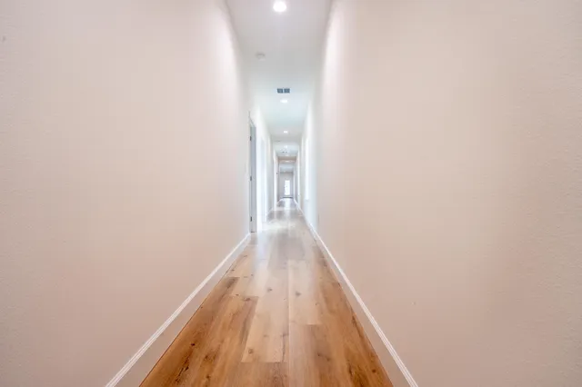 a bathroom with a sink toilet a mirror and shower