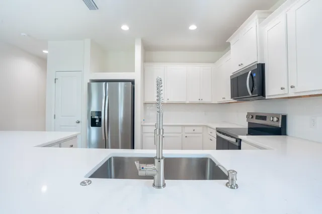 a bathroom with a bathtub and a sink