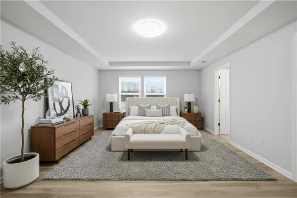 a spacious bedroom with a bed and a couch