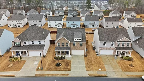 an aerial view of residential houses with outdoor space
