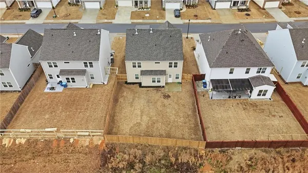 an aerial view of residential houses with outdoor space