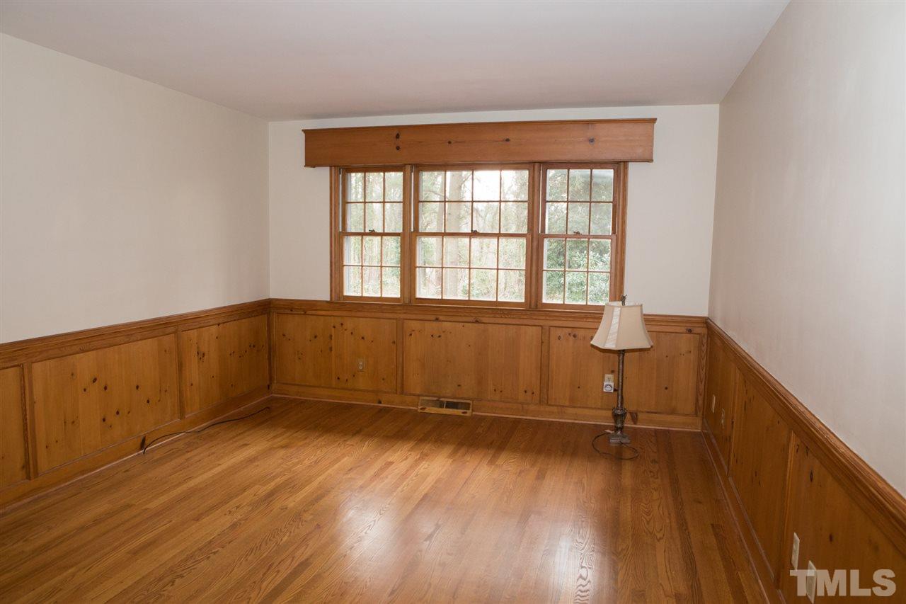 314 Cates Street Roxboro, NC 27573 - Photo 12 of 19 an empty room with wooden floor and windows