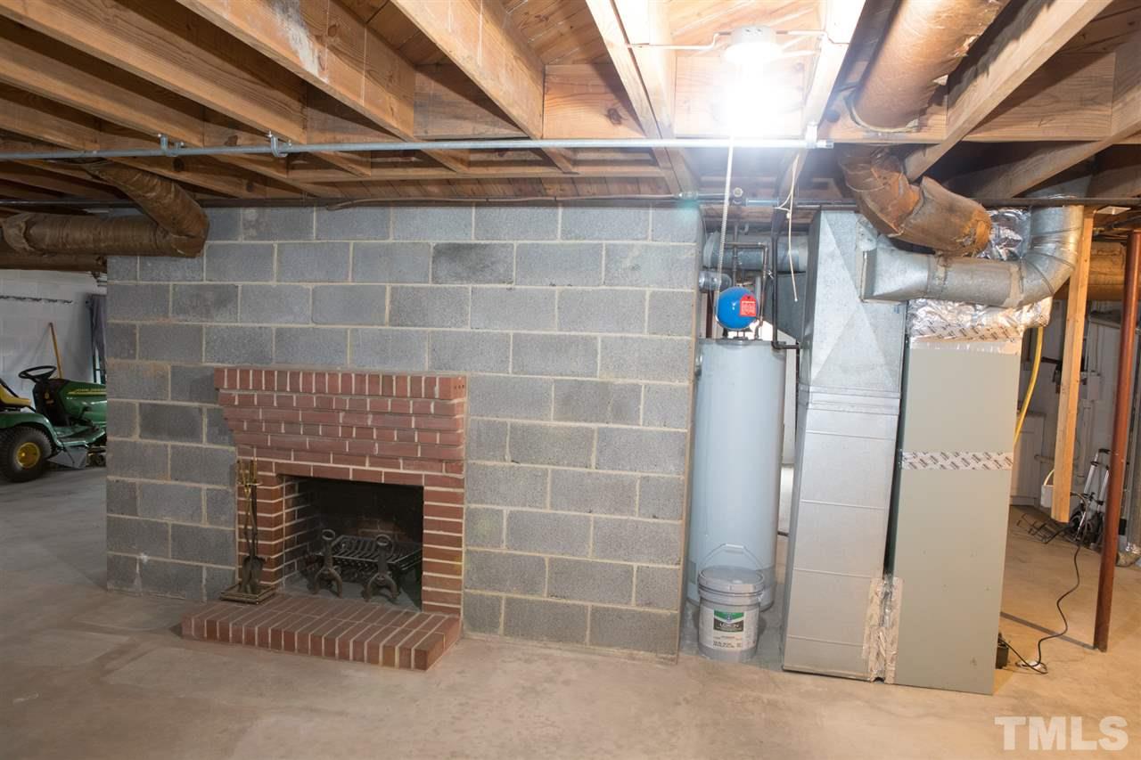 314 Cates Street Roxboro, NC 27573 - Photo 17 of 19 a view of empty room with a fireplace