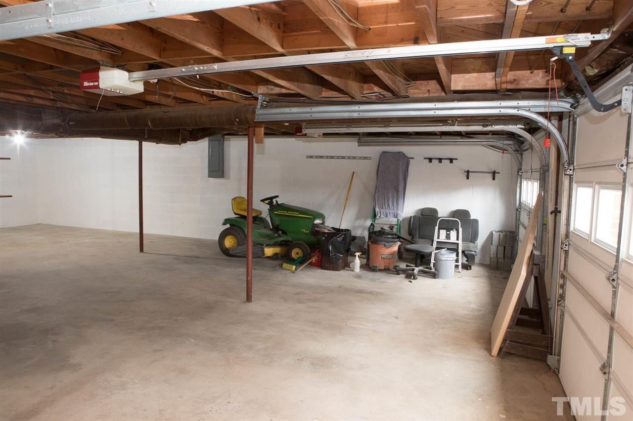 314 Cates Street Roxboro, NC 27573 - Photo 19 of 19 a view of a garage with a white car