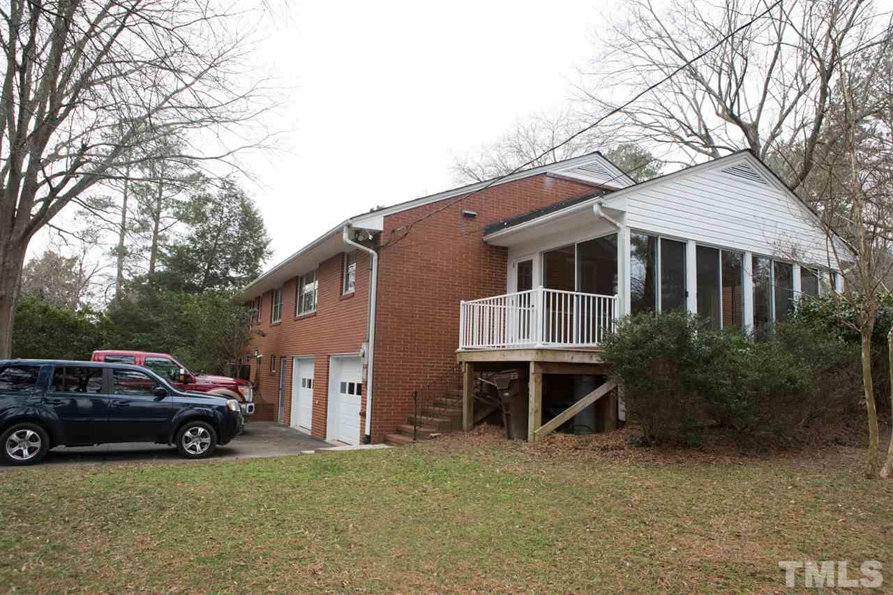 314 Cates Street Roxboro, NC 27573 - Photo 3 of 19 a house view with a garden space