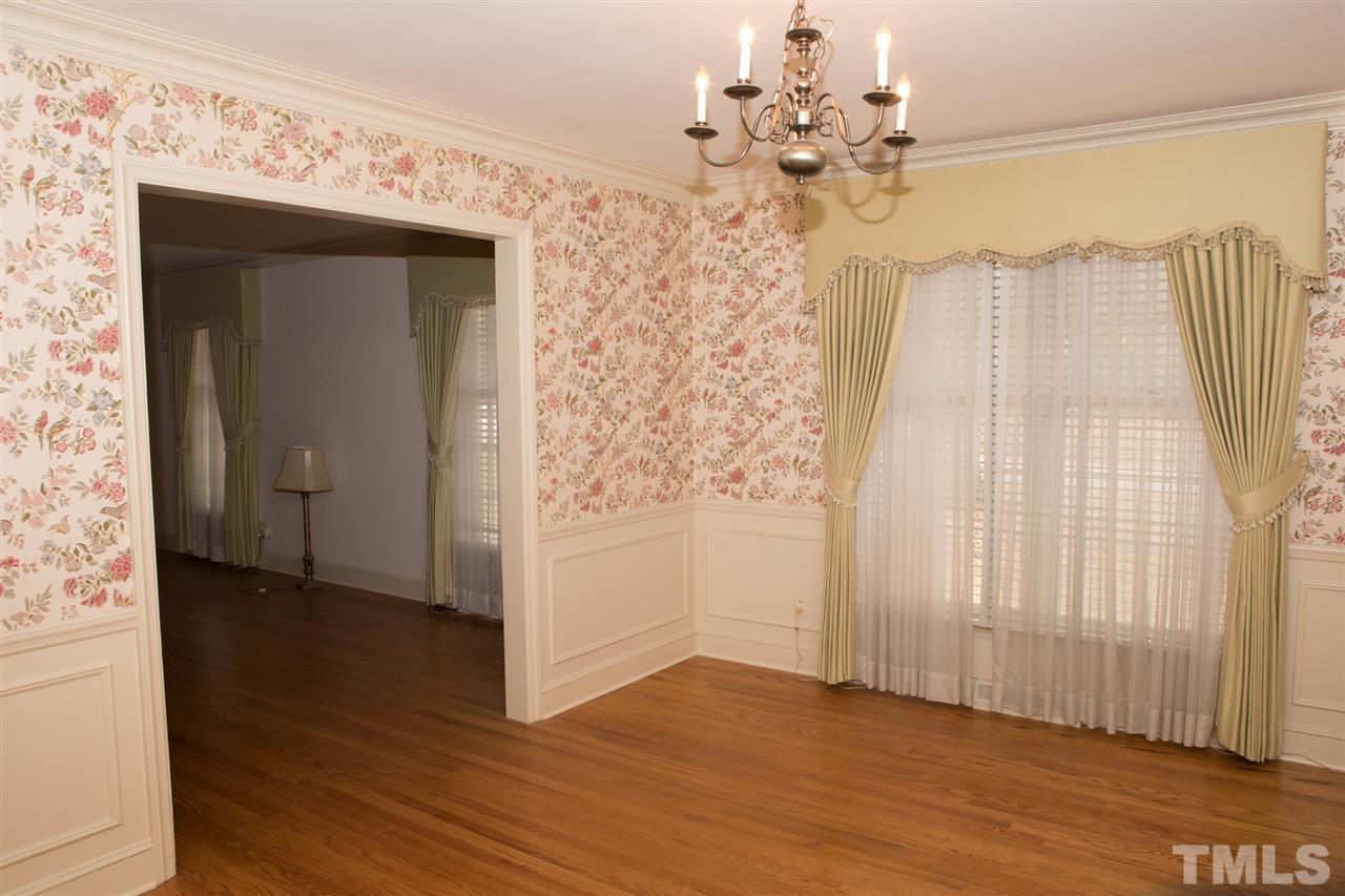 314 Cates Street Roxboro, NC 27573 - Photo 4 of 19 wooden floor in an empty room with a window