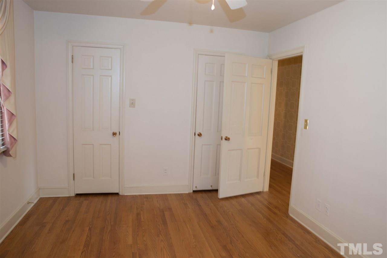314 Cates Street Roxboro, NC 27573 - Photo 6 of 19 a view of a hallway with wooden floor