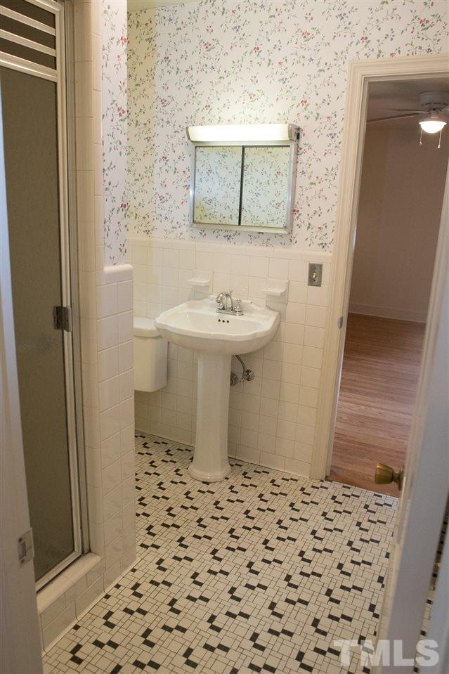 314 Cates Street Roxboro, NC 27573 - Photo 10 of 19 a bathroom with a sink and a mirror