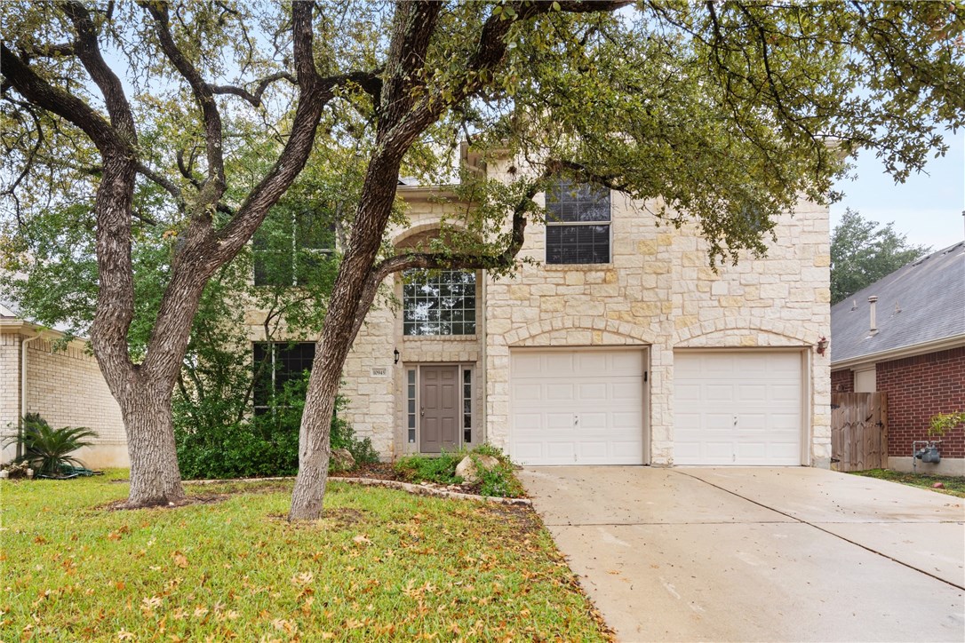 10945 Colonel Winn Loop Austin, TX 78748 - Photo 1 of 1 With Texas Limestone and native Oak Trees give this home nice curb appeal.