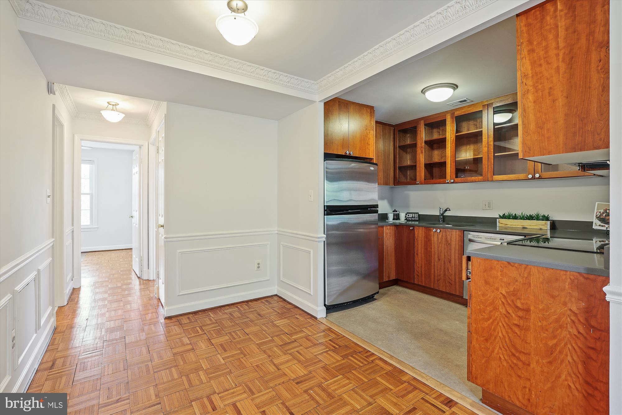 1803 T Street Northwest, Unit 3 Washington, DC 20009 - Photo 14 of 45 a kitchen with stainless steel appliances granite countertop a refrigerator and a stove top oven