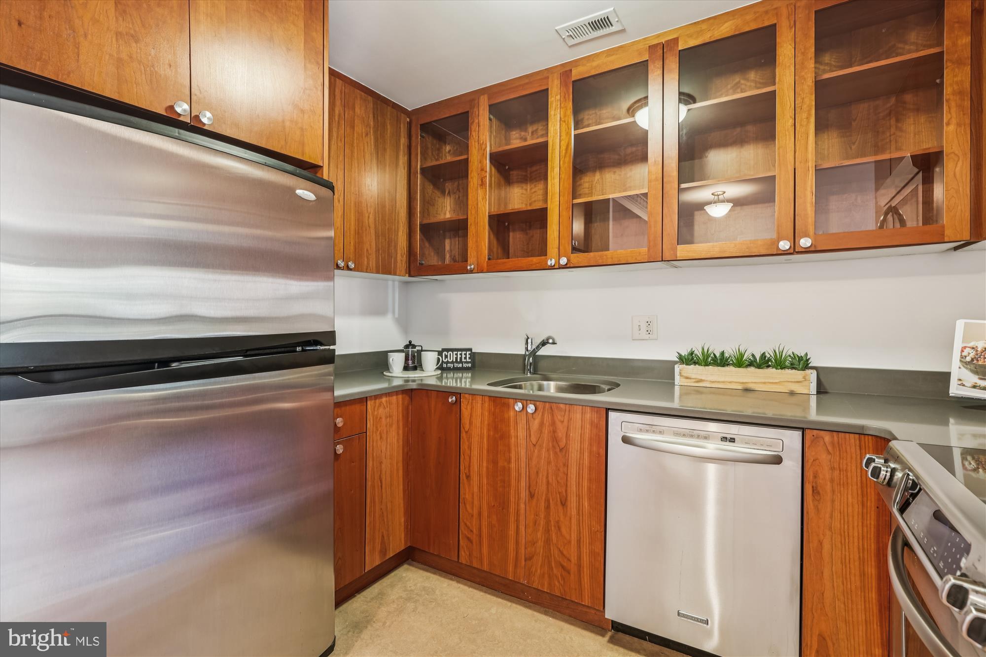 1803 T Street Northwest, Unit 3 Washington, DC 20009 - Photo 16 of 45 a kitchen with a sink and cabinets