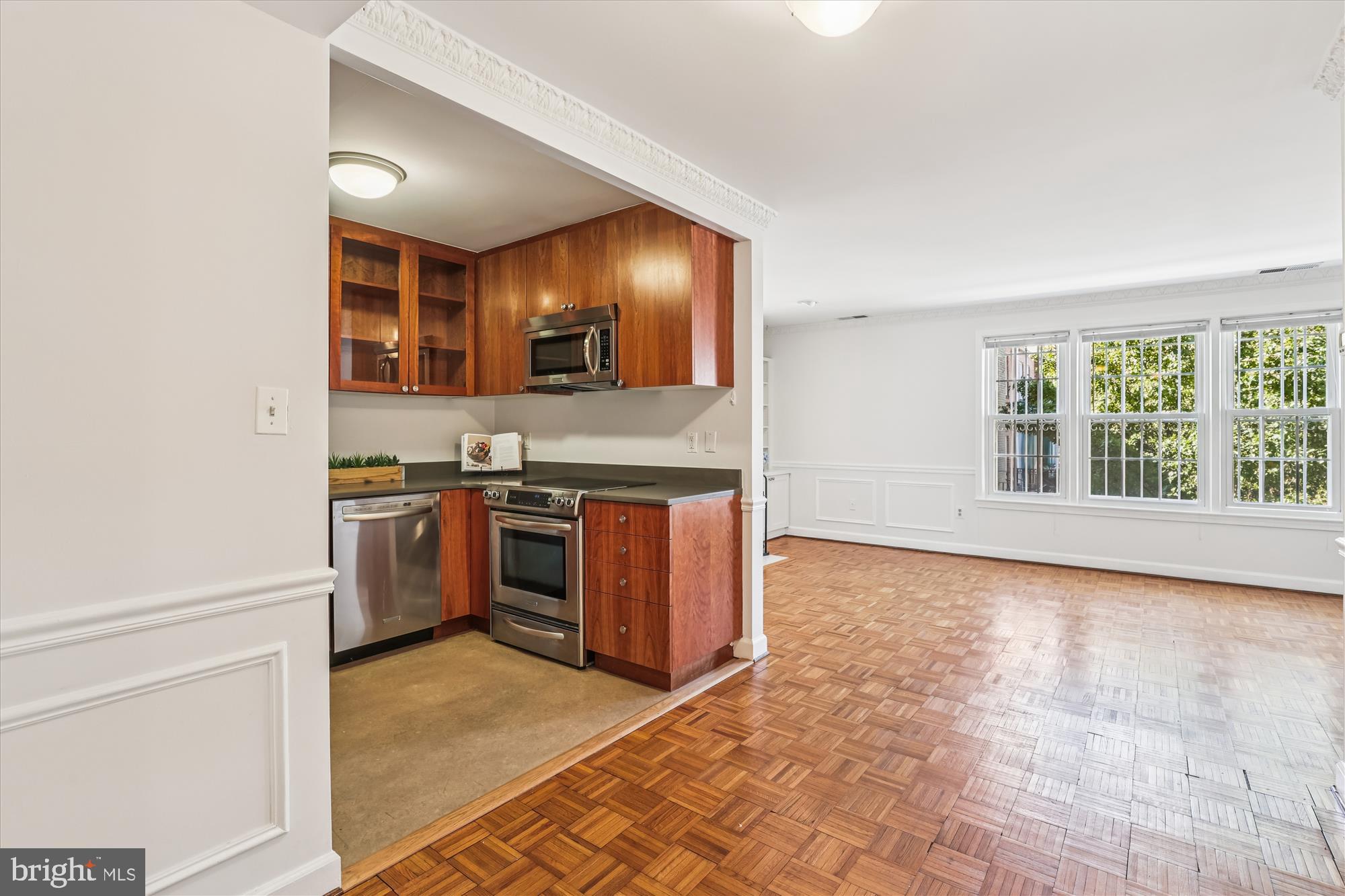 1803 T Street Northwest, Unit 3 Washington, DC 20009 - Photo 18 of 45 a view of a kitchen with stainless steel appliances granite countertop a stove and a sink