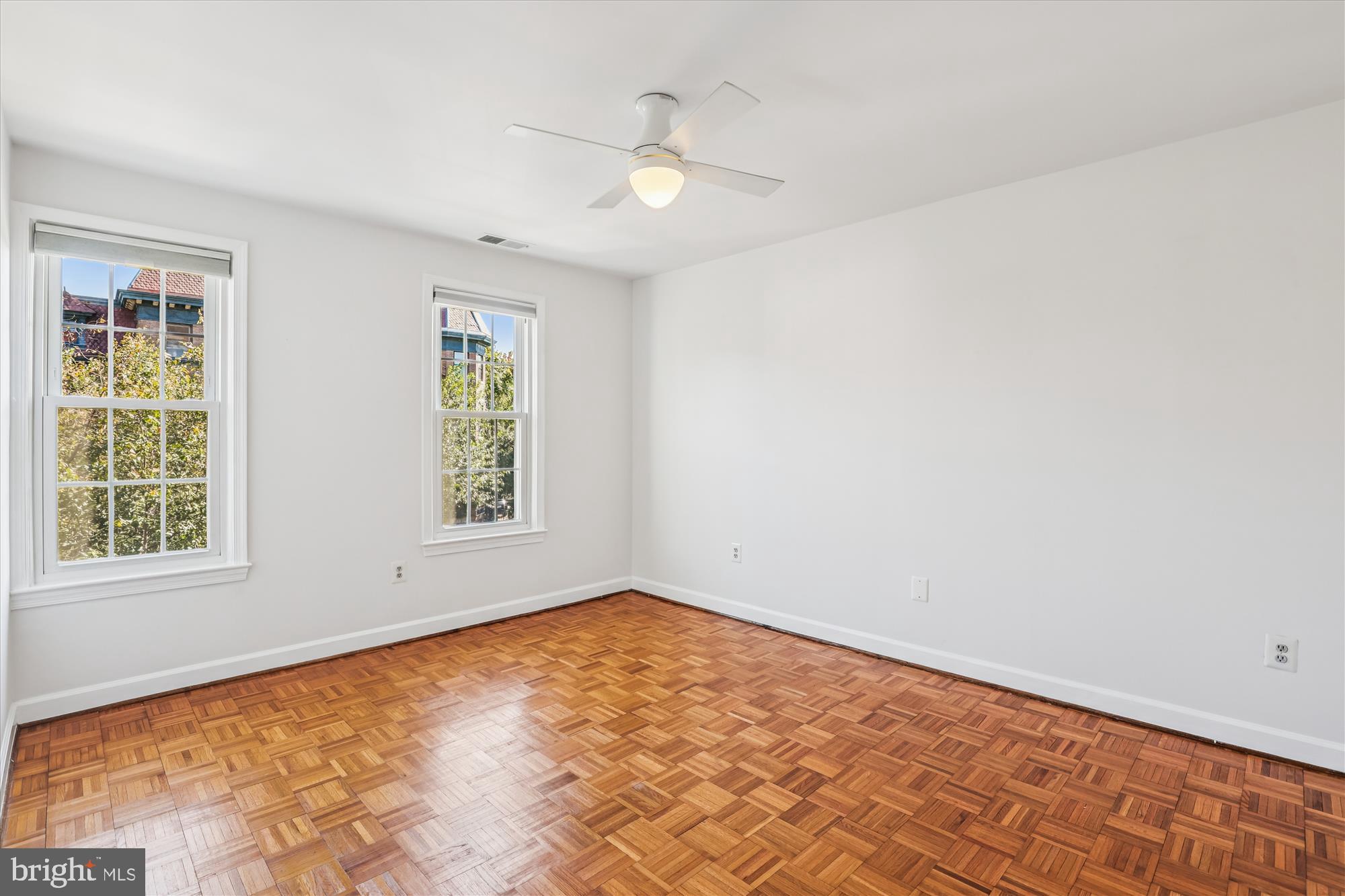 1803 T Street Northwest, Unit 3 Washington, DC 20009 - Photo 24 of 45 wooden floor in an empty room with a window