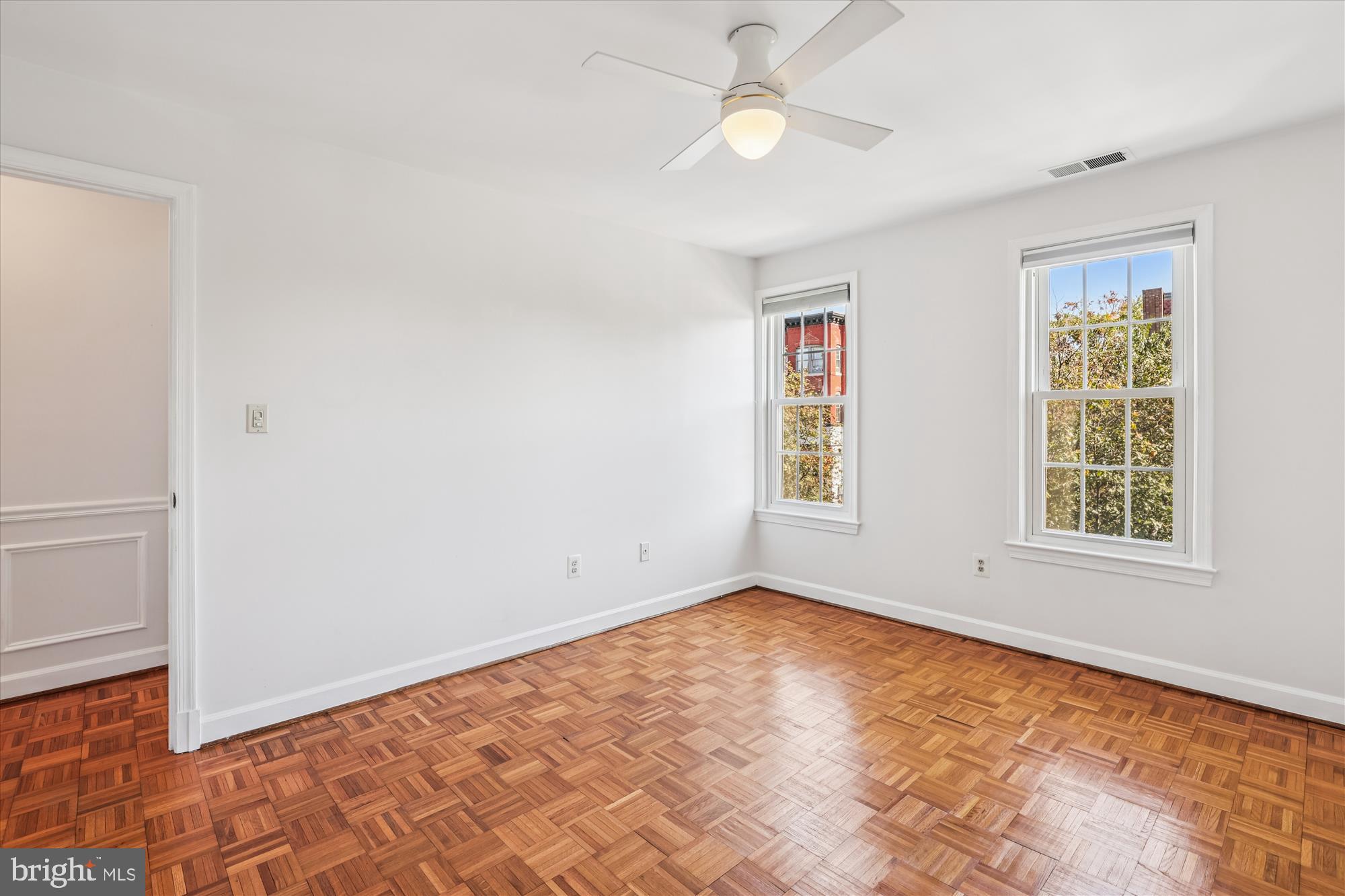 1803 T Street Northwest, Unit 3 Washington, DC 20009 - Photo 25 of 45 wooden floor in an empty room with a window