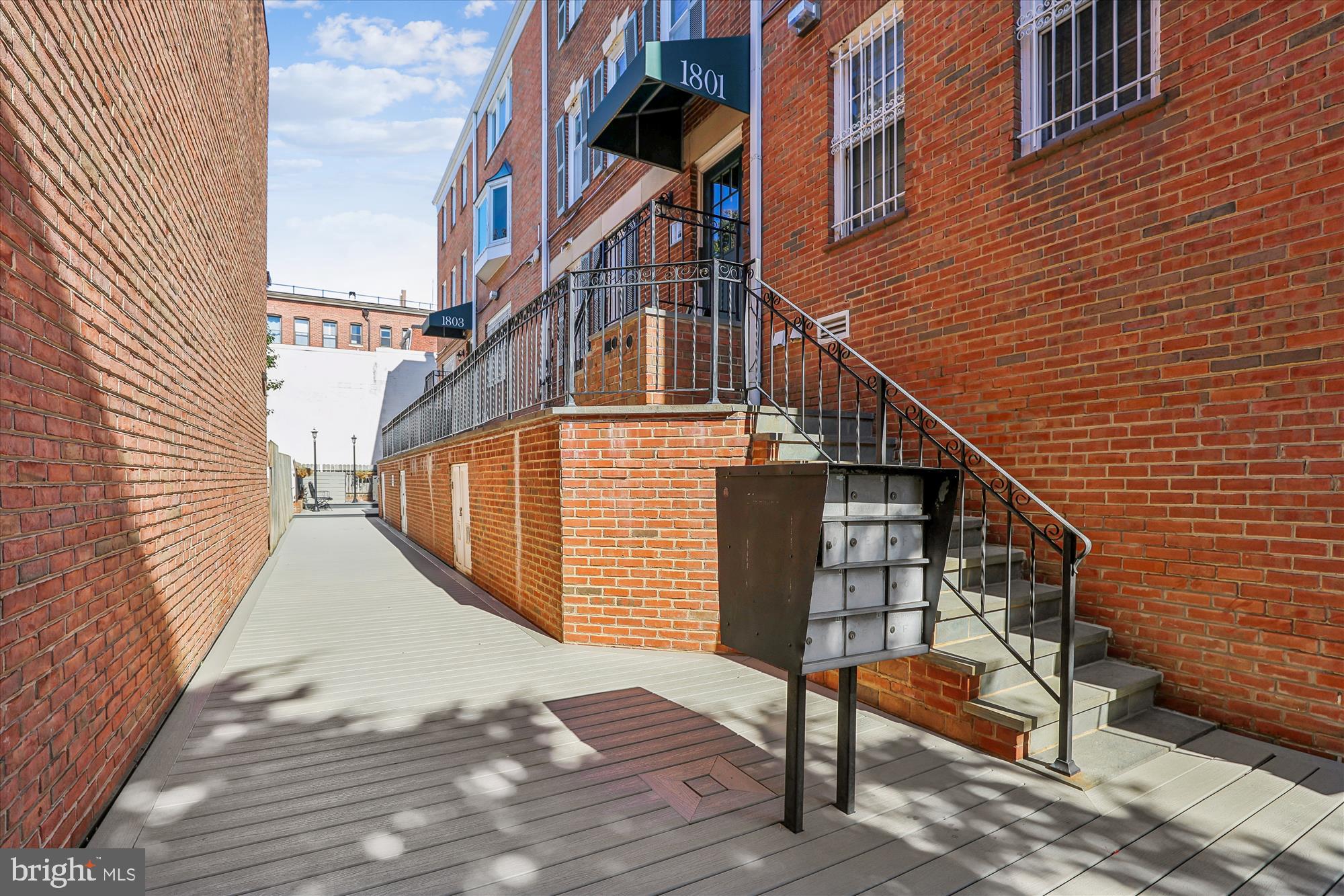 1803 T Street Northwest, Unit 3 Washington, DC 20009 - Photo 4 of 45 a view of staircase with wooden floor and white walls