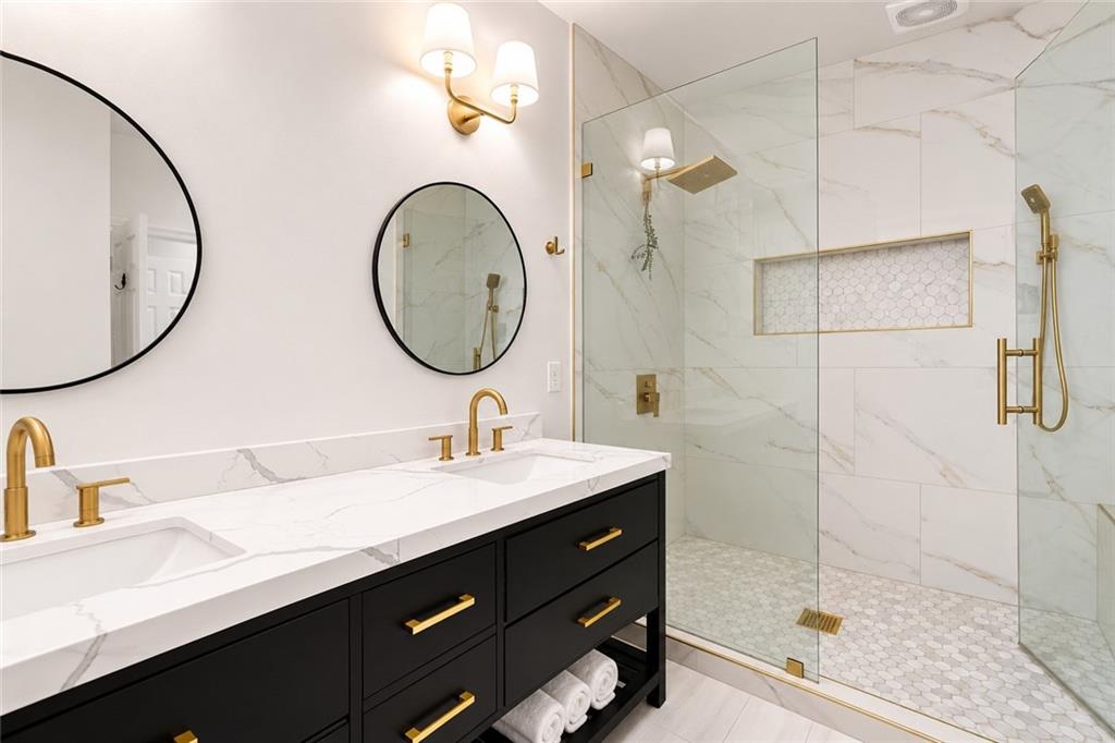 2300 Habersham Marina Road, Unit 302 Cumming, GA 30041 - Photo 23 of 31 a bathroom with a sink and a mirror