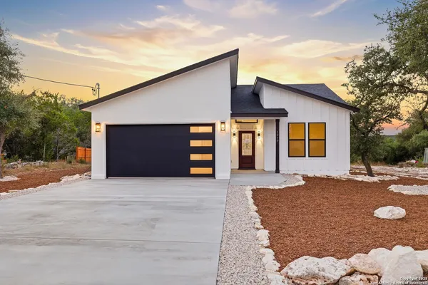 a front view of a house with yard
