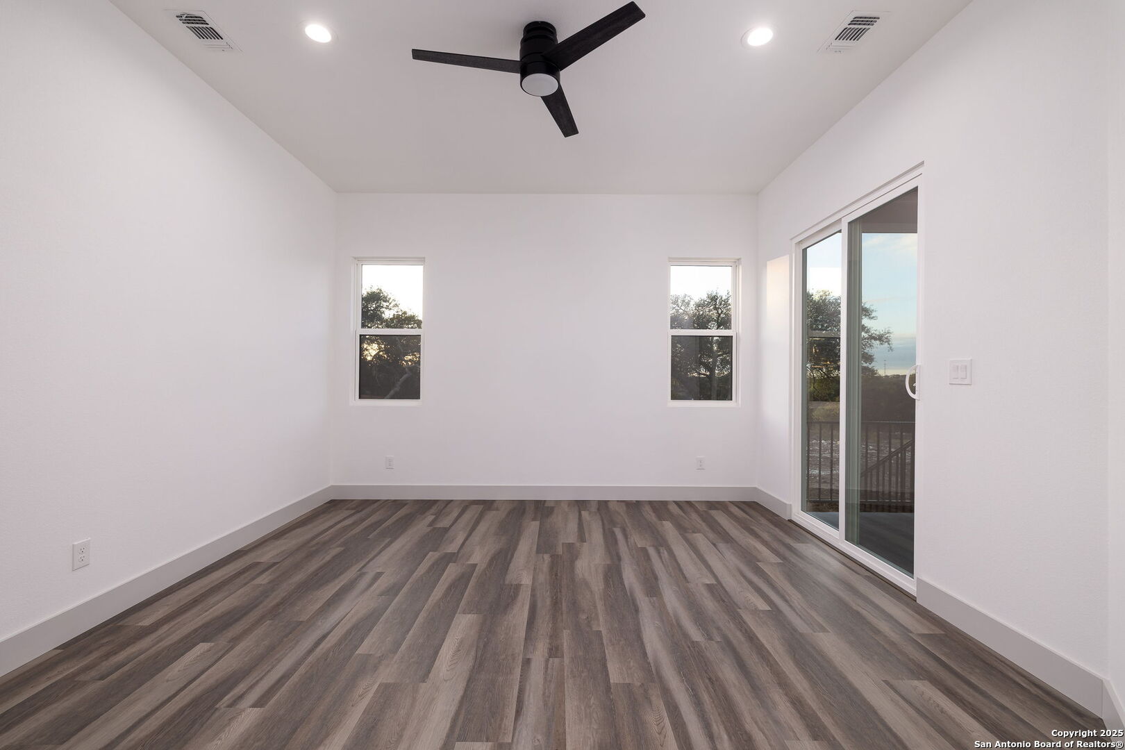 1210 Fernwood Road Fischer, TX 78623 - Photo 24 of 36 wooden floor in an empty room with a window