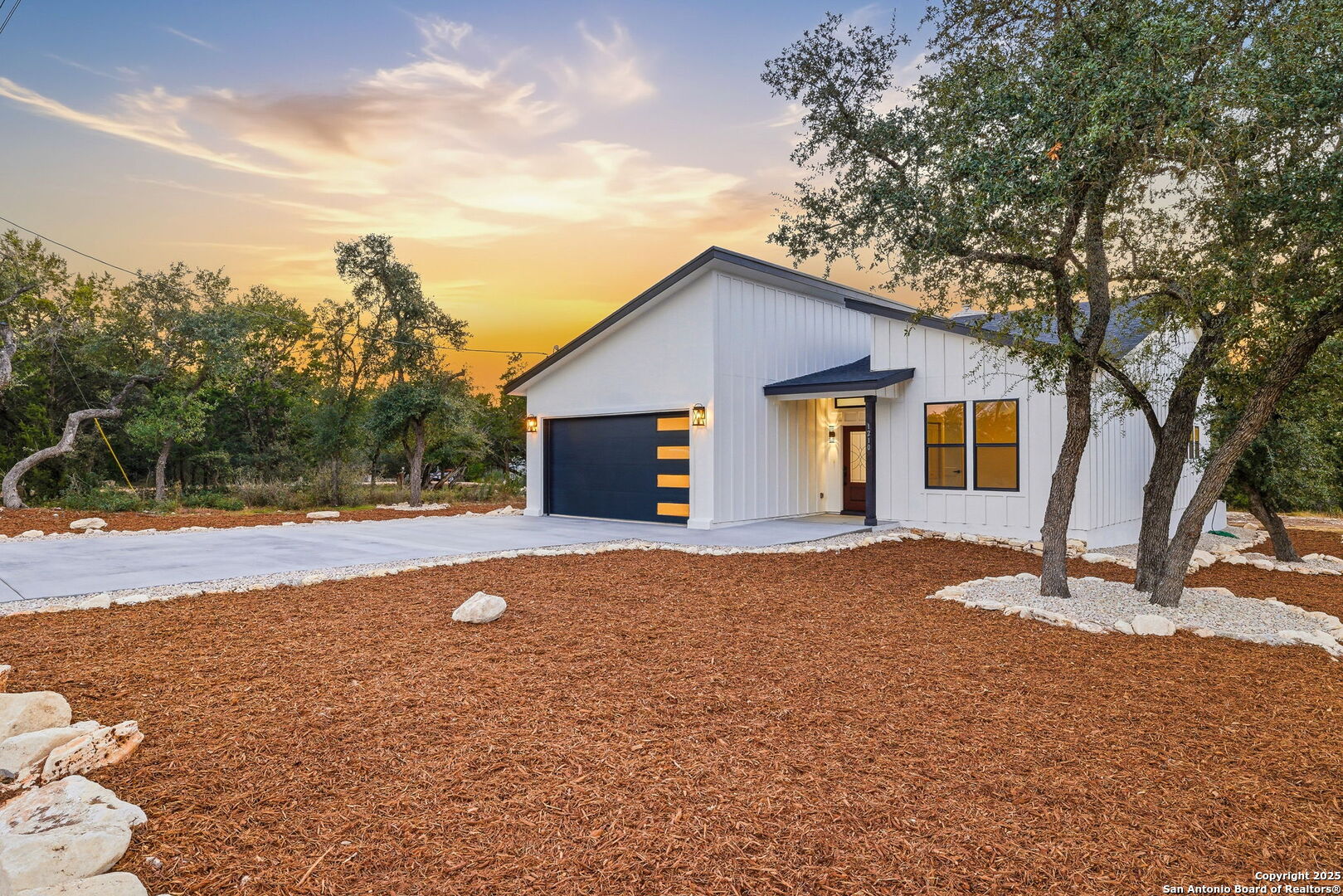 1210 Fernwood Road Fischer, TX 78623 - Photo 4 of 36 a view of a house with backyard and trees